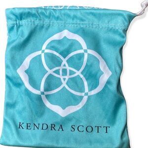 Kendra Scott jewelry bag in turquoise with white signature pattern drawstring